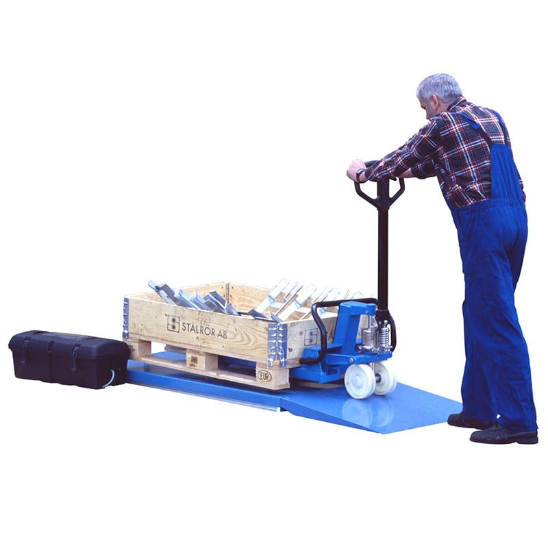 Low-profile scissor lift table with ramp allows for easy loading using a pallet truck