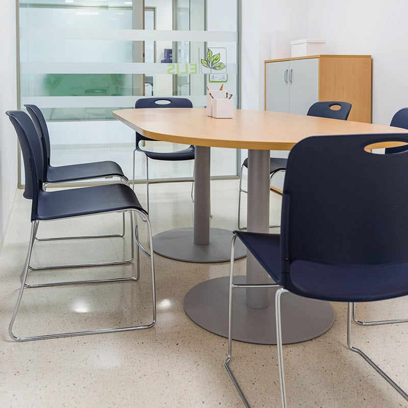 Maestro stacking chairs around office boardroom table