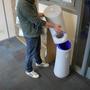 Wet wipe dispenser with easy to empty waste bin