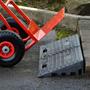 Two rubber kerb ramps used to create easy access for hand truck