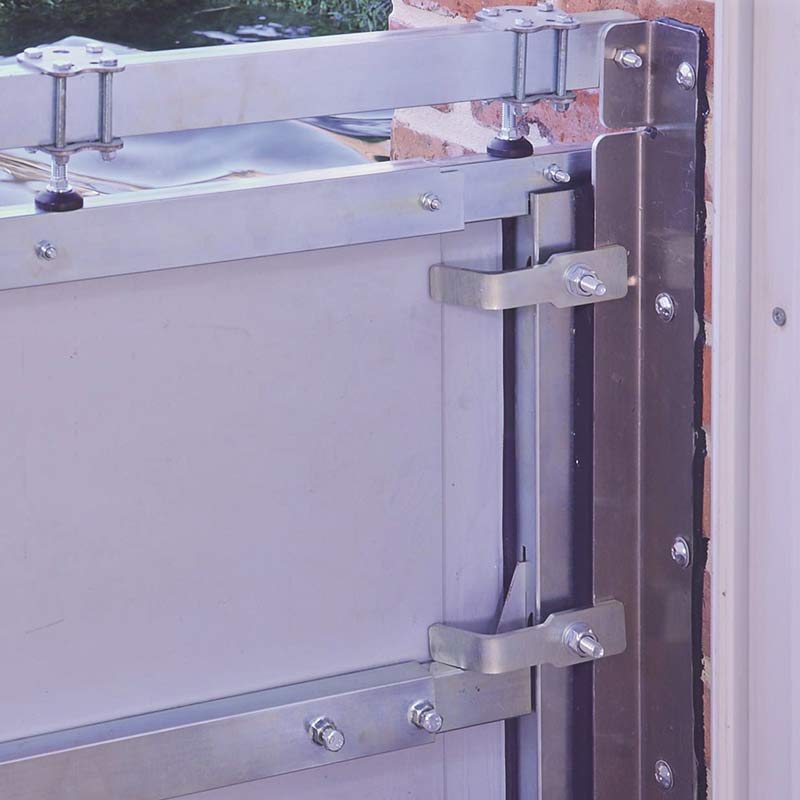 Adjustable steel doorway flood barrier