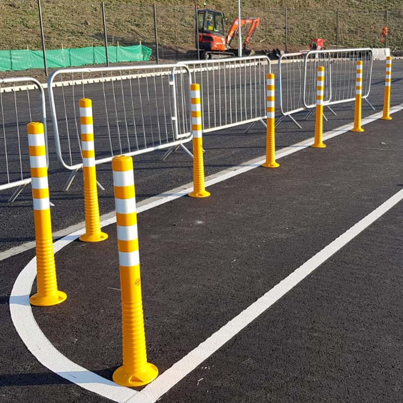 Flexible yellow & white delineator posts creating a barrier