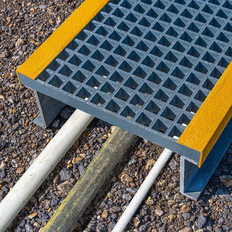 GRP step-over platform protects pipes and cables