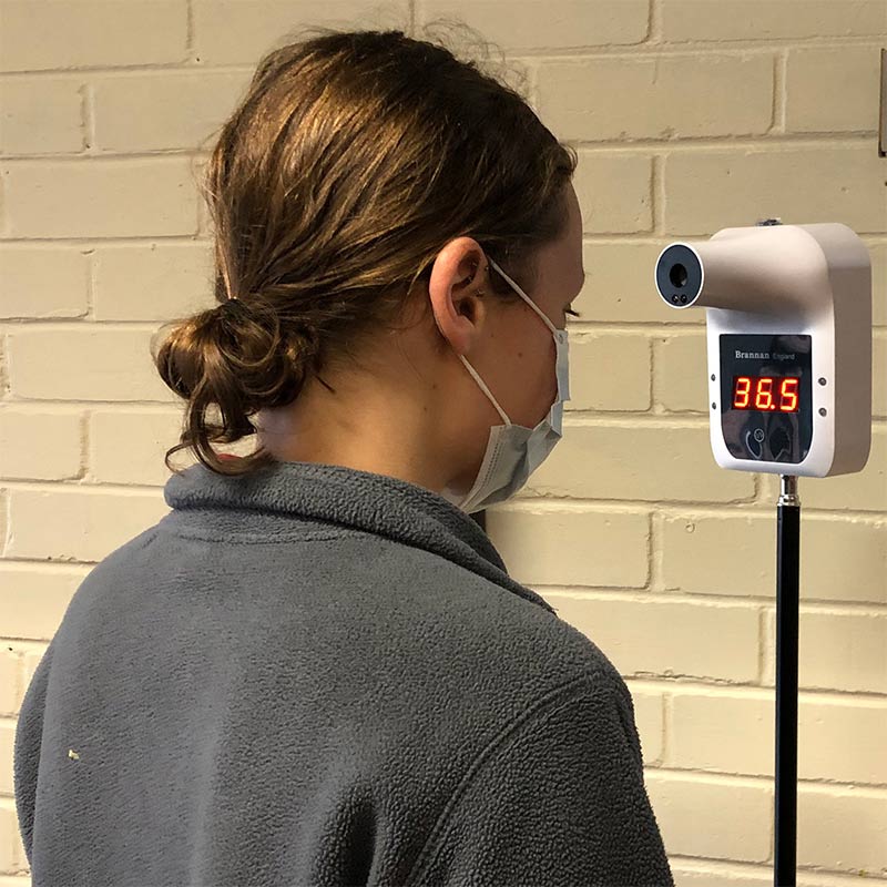 Infrared non-contact thermometer mounted on tripod