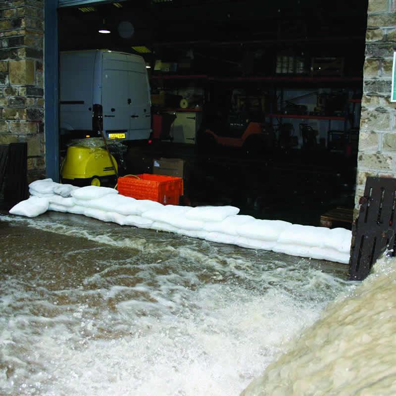 Expanding sandbags in a warehouse door