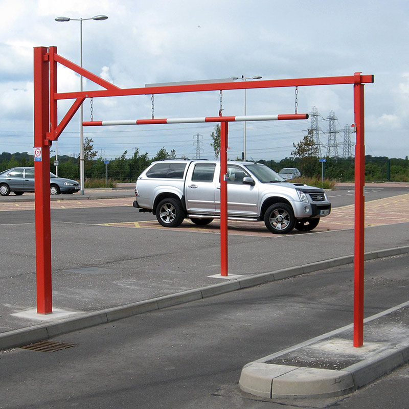 Height restriction barrier with swing top to allow taller vehicles through if required