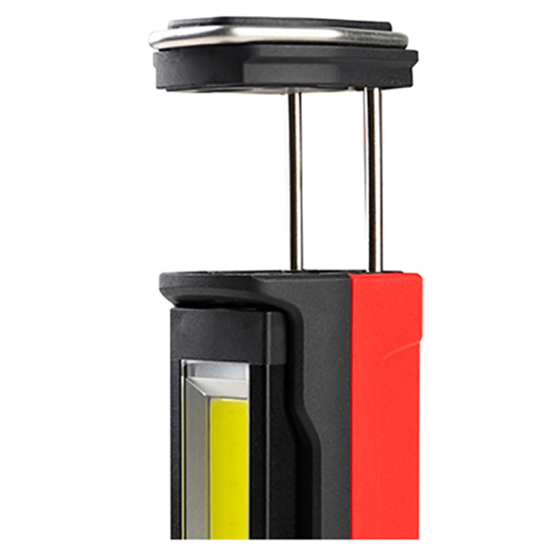 Work light with spring-loaded base