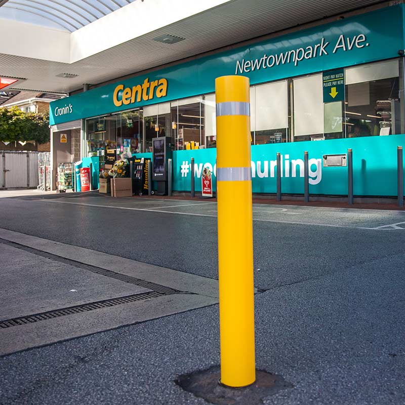 Yellow bollard sleeve at petrol station